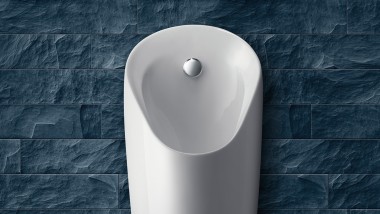 Preda urinaali asennuttuna harmaaseen seinään (© Geberit)